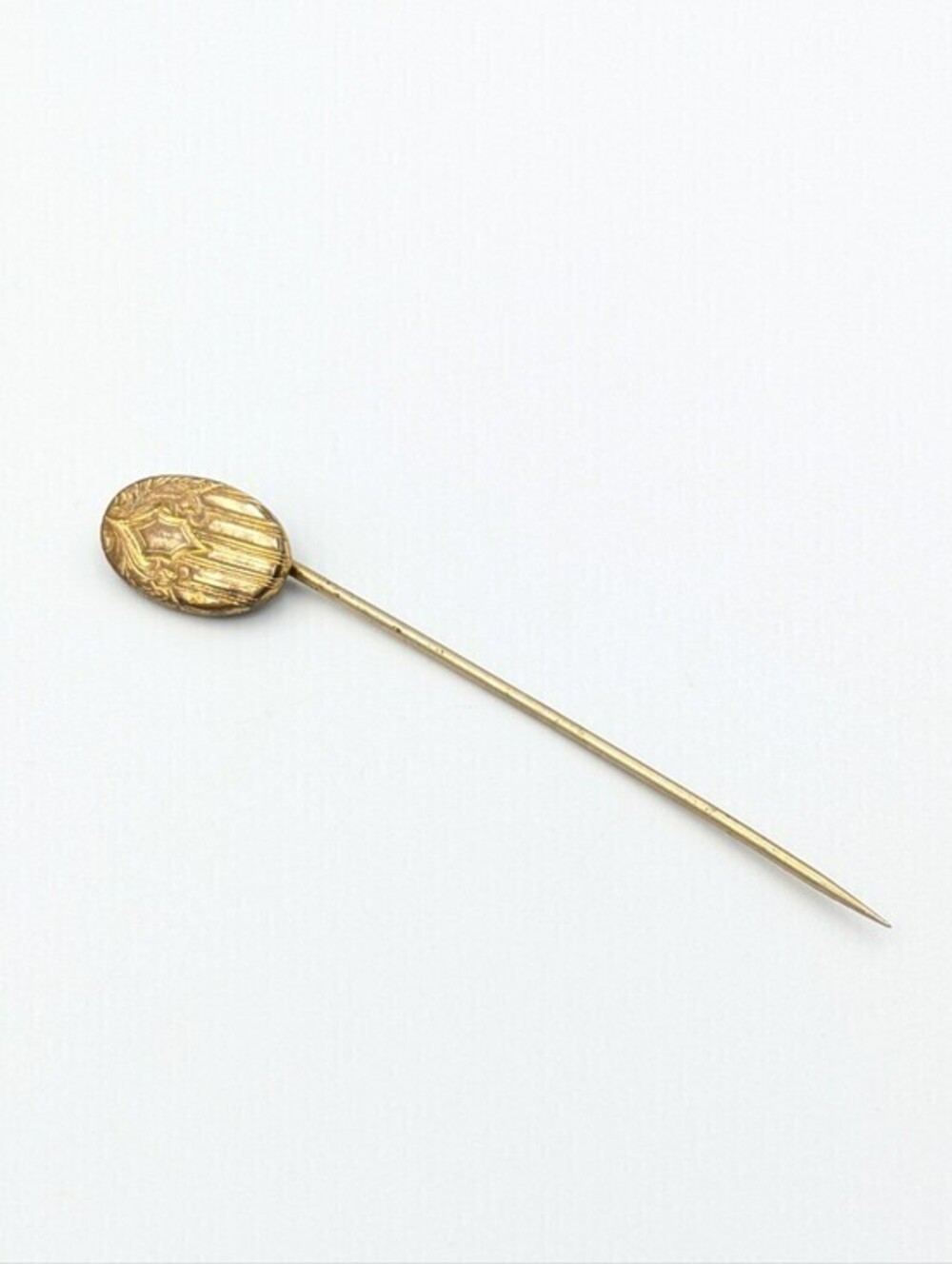 Antique oval gold tone stick pin Signed
